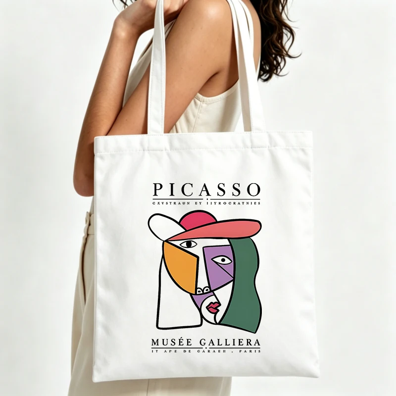 abstract face graphic canvas tote bag with artistic print, ideal for daily shopping and casual outings
