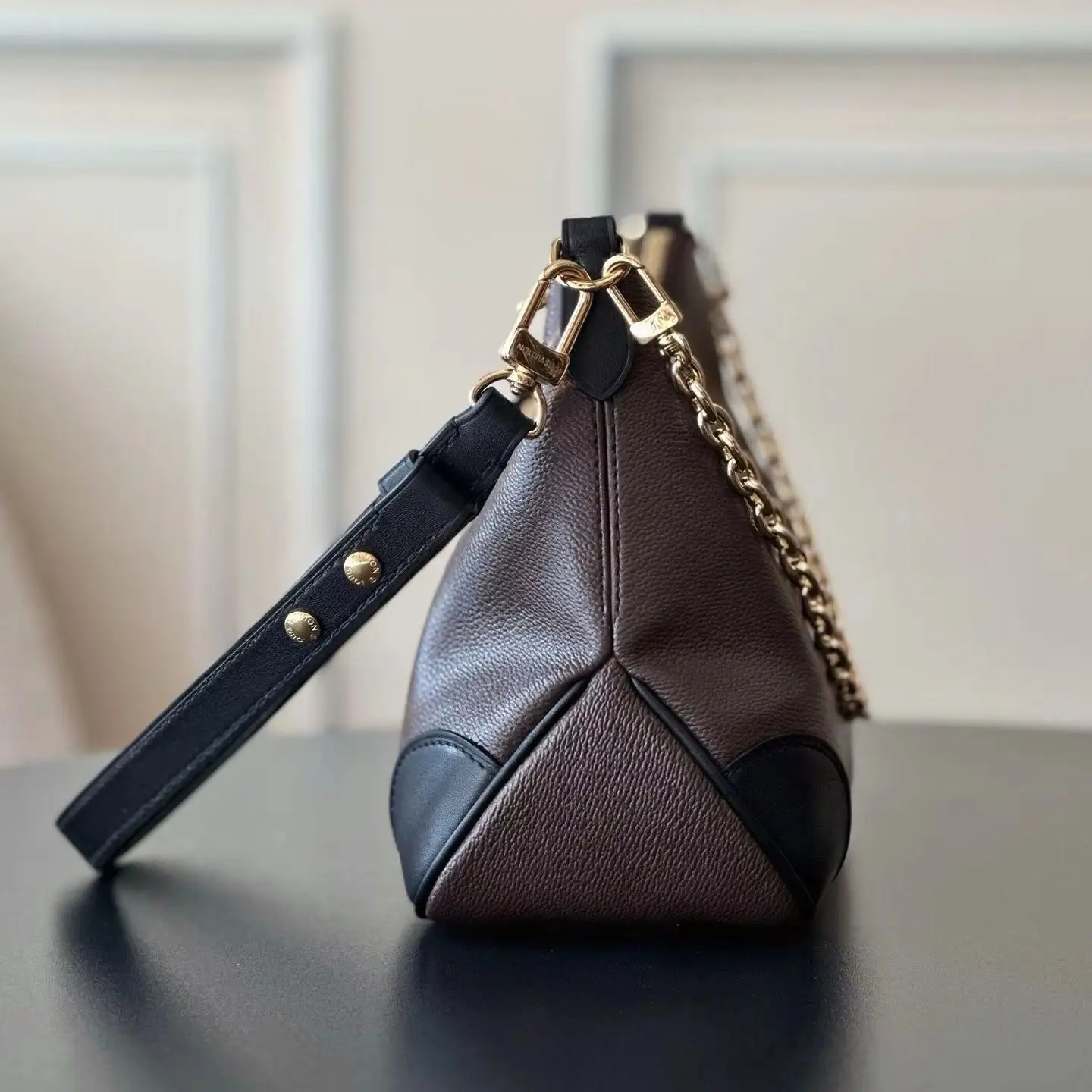 

Retro mini underarm zipper bag, half-moon top opening, gold zipper closure, with a matte pebbled leather texture.