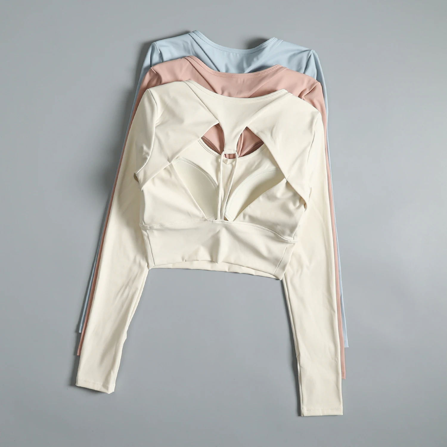 

Women's Autumn and Winter Beautiful Slimming Pilates Yoga Wear Sports Fitness Tops with Chest Pads for Running and Exercise