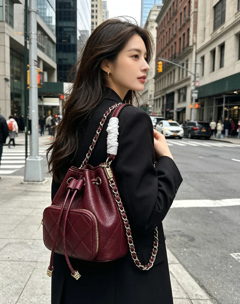 

Elegant Burgundy Quilted Leather Backpack for Women Luxury Drawstring Bucket Bag with Chain Strap for Travel and Daily Commute