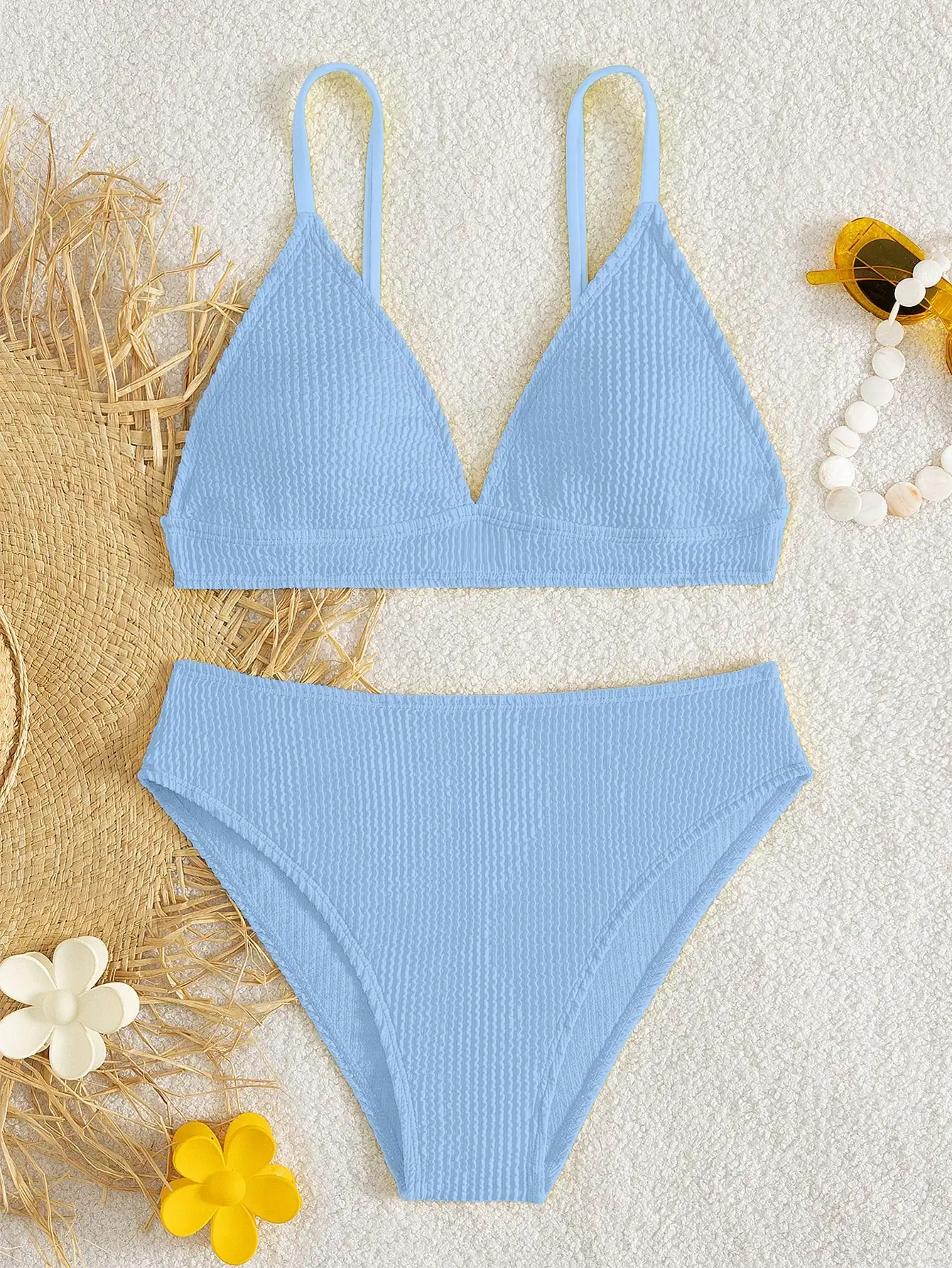 

Синий волнистый жаккардовый комплект бикини с треугольными чашечками, на тонких бретелях и с глубоким V-образным вырезом