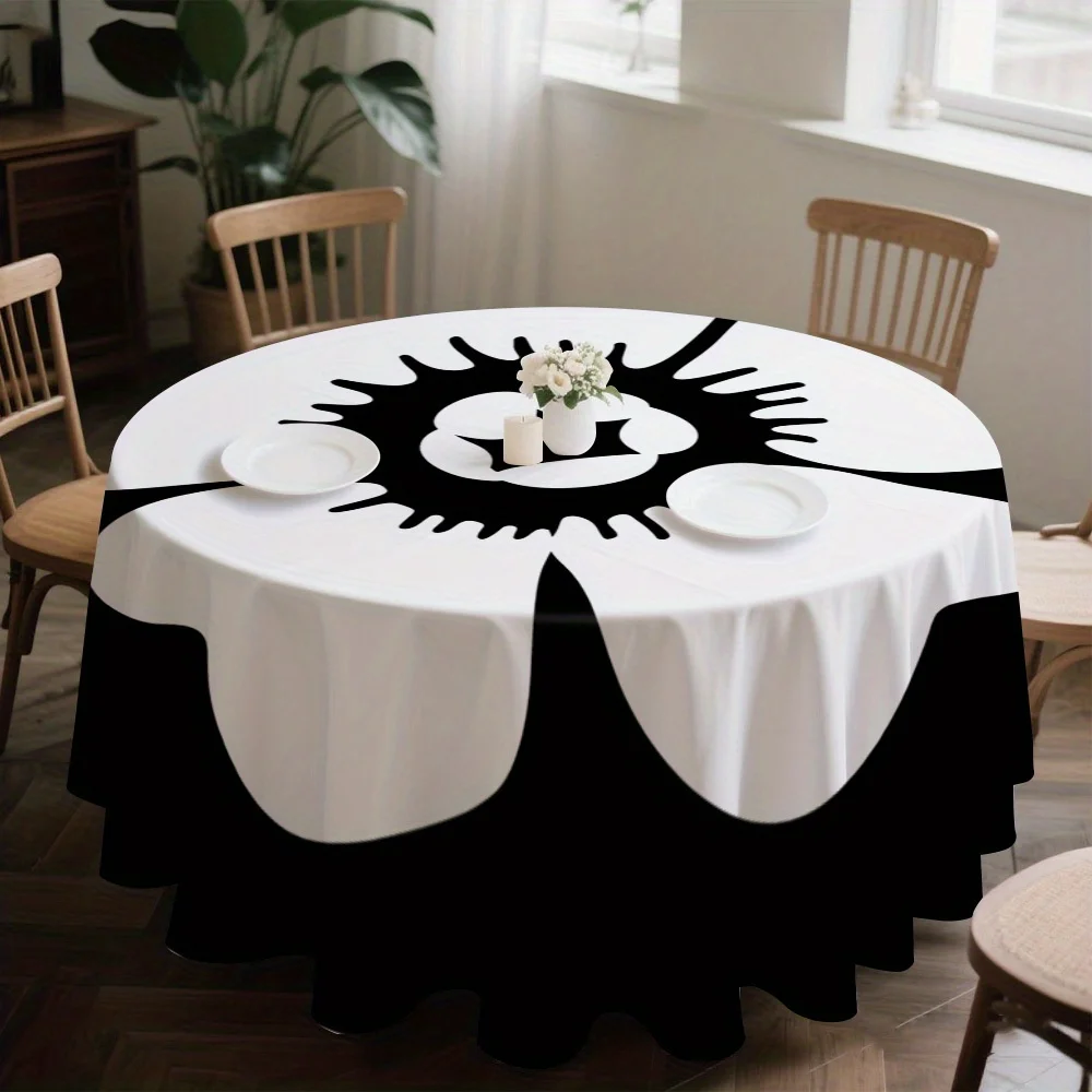 A round tablecloth with a black and white floral pattern, which is perfect for displaying on the kitchen table.zyc