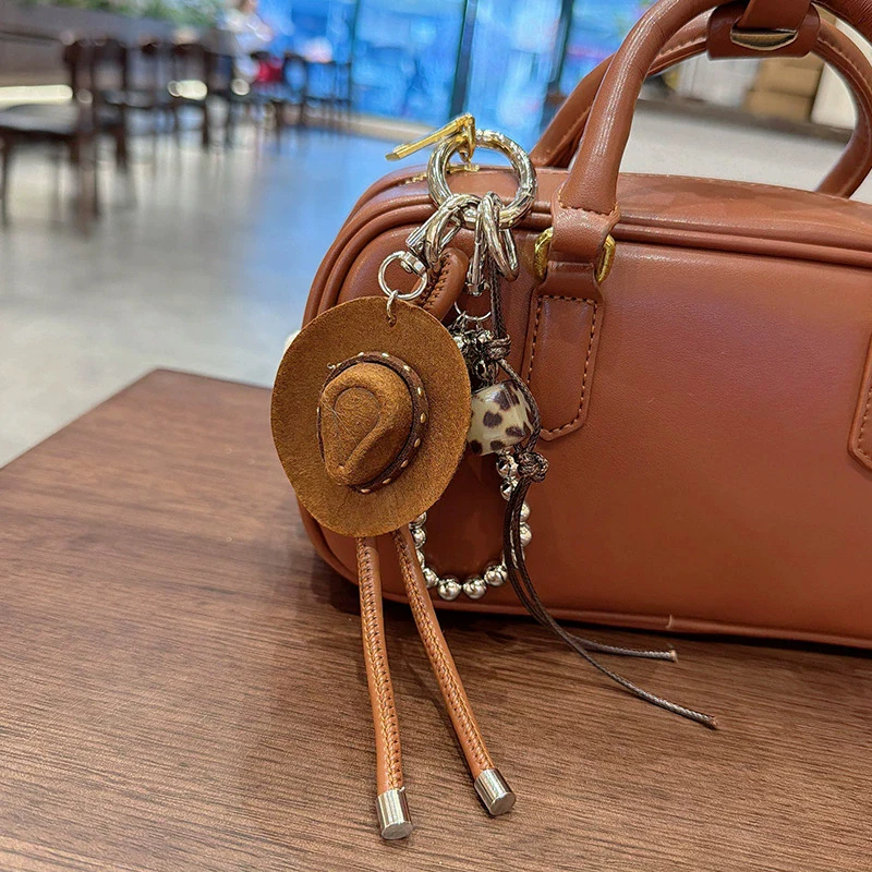 Porte-clés pendentif chapeau de cowboy porte-bonheur, fait main, en corde tressée et similicuir, breloque de bonheur et de bénédiction, pour clés de voiture, sacs et porte-monnaie