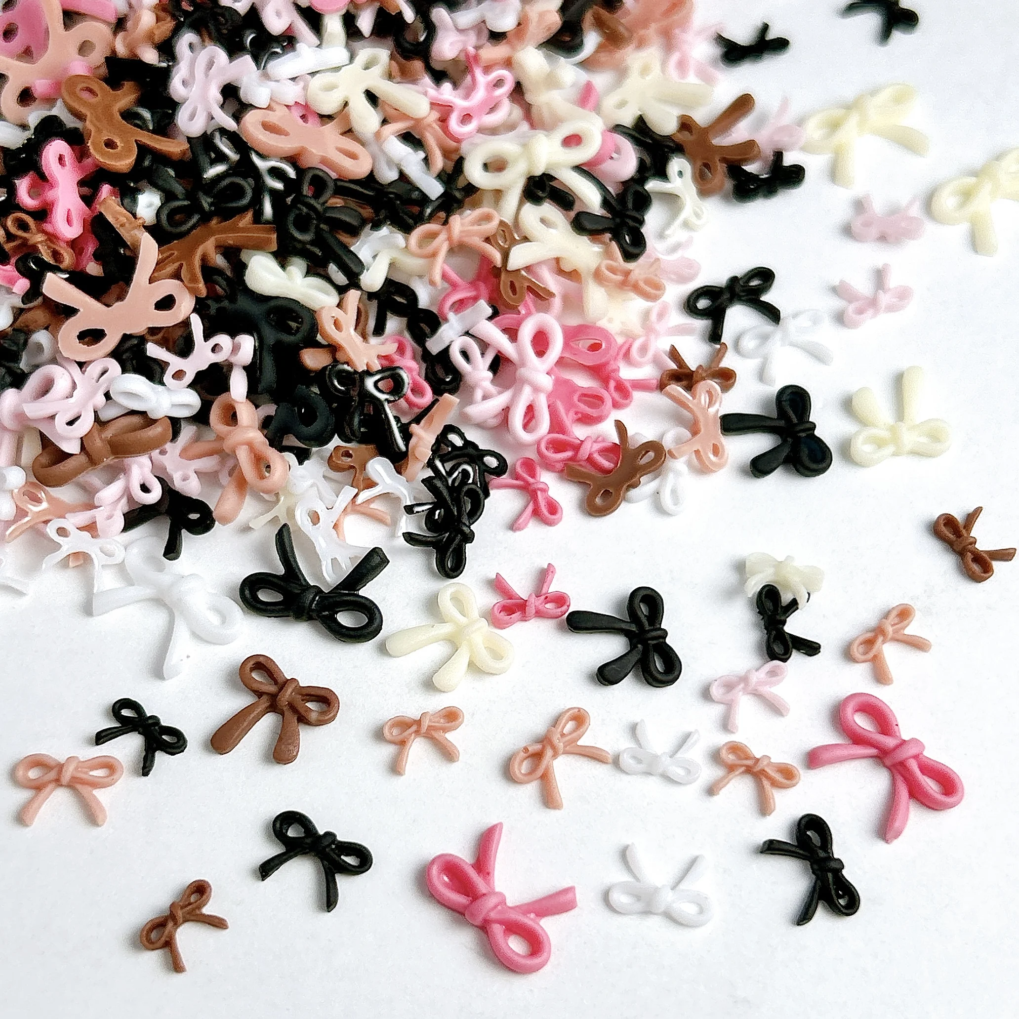50PCS Sweet Solid Color Line Bows Nail Charms Multi Sized Hollowed Bowknots Resin Nail Art Decorations for DIY Nails Ornaments
