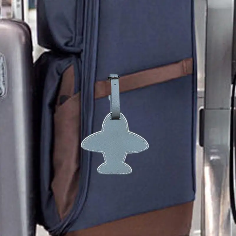 ป้ายติดกระเป๋าเดินทางแบบป้ายกระเป๋าป้ายแท็กเครื่องบินหนังสำหรับเดินทางแบบตลกสำหรับกระเป๋าถือเดินทางเครื่องระบุกระเป๋าเดินทาง