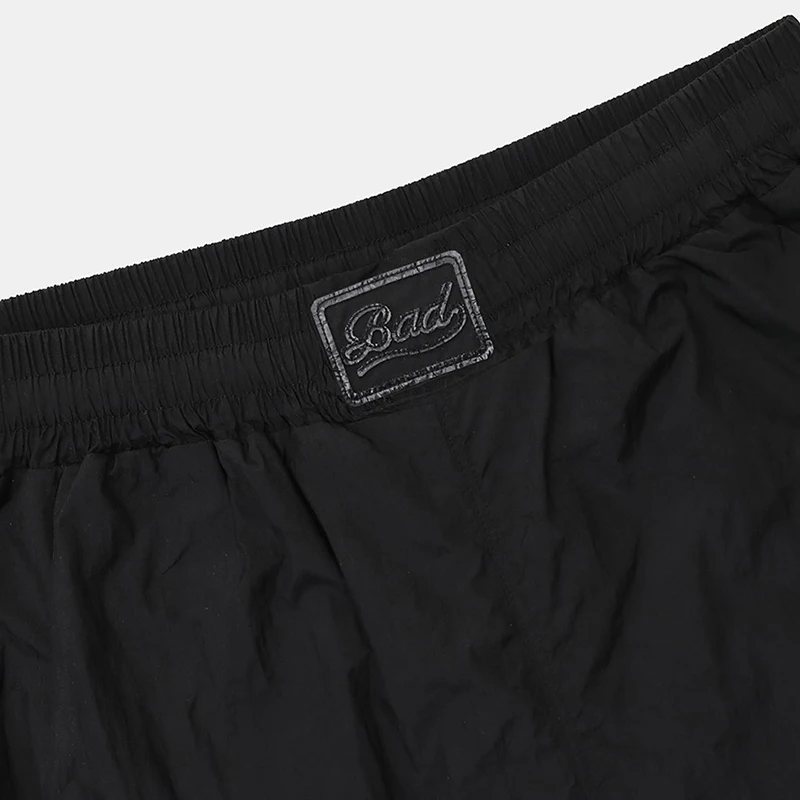 アメリカンスタイルのレトロスポーツショーツ女性カジュアルルーズストレートカット5点トレンディパンツポケット付き通勤スタイル