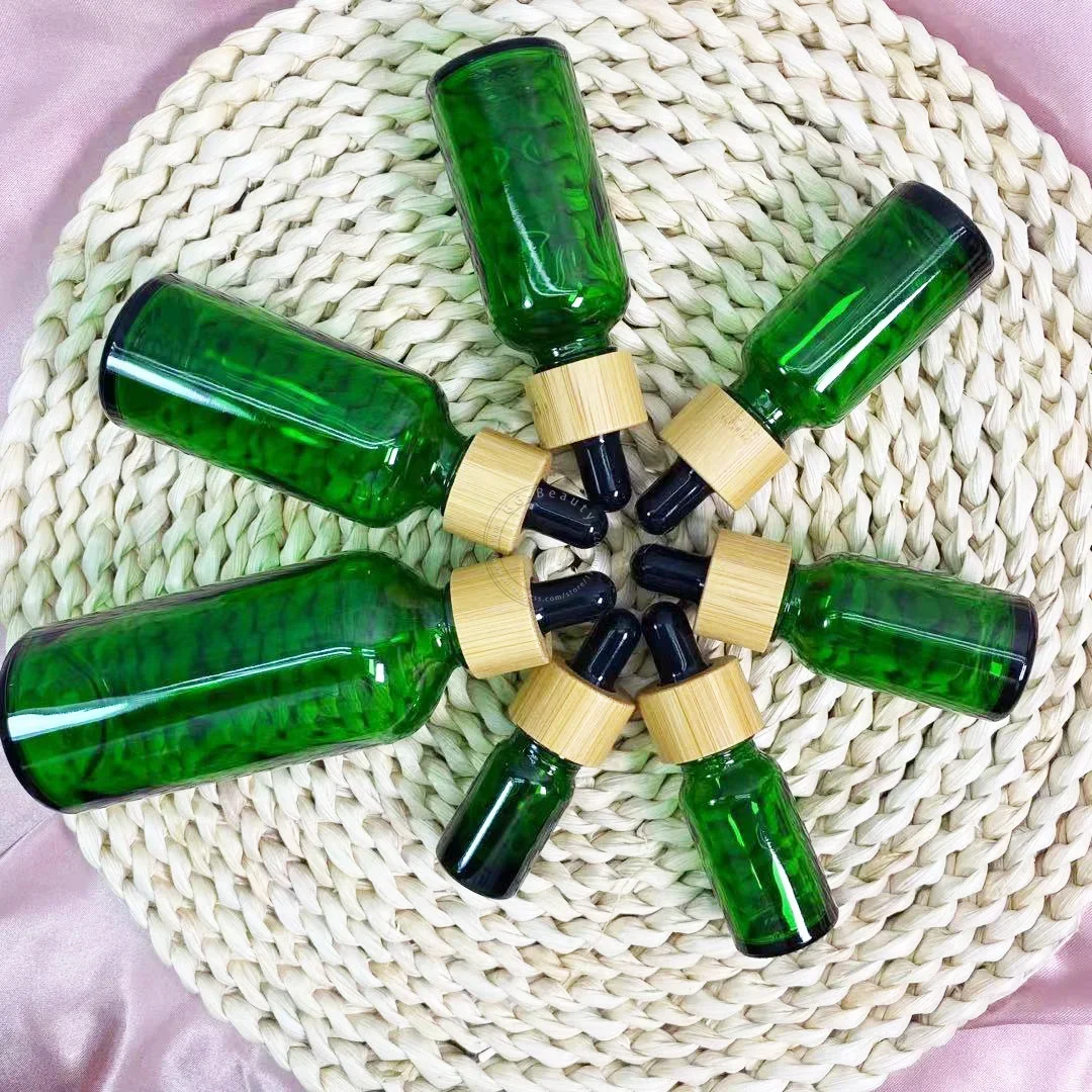 Whosesale frascos de garrafa conta-gotas de vidro âmbar/verde/azul/preto de alta qualidade com tampa de bambu pipeta para garrafas de perfumes cosméticos