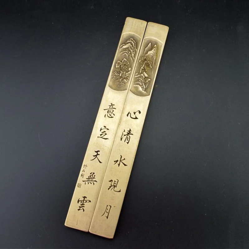 

Office supplies stationery essentials: brass paperweight, press, and paper weight