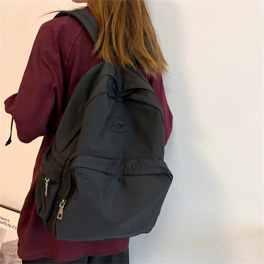 Mochila escolar de nailon para mujer, morral de hombro de Color sólido, a la moda, para viaje