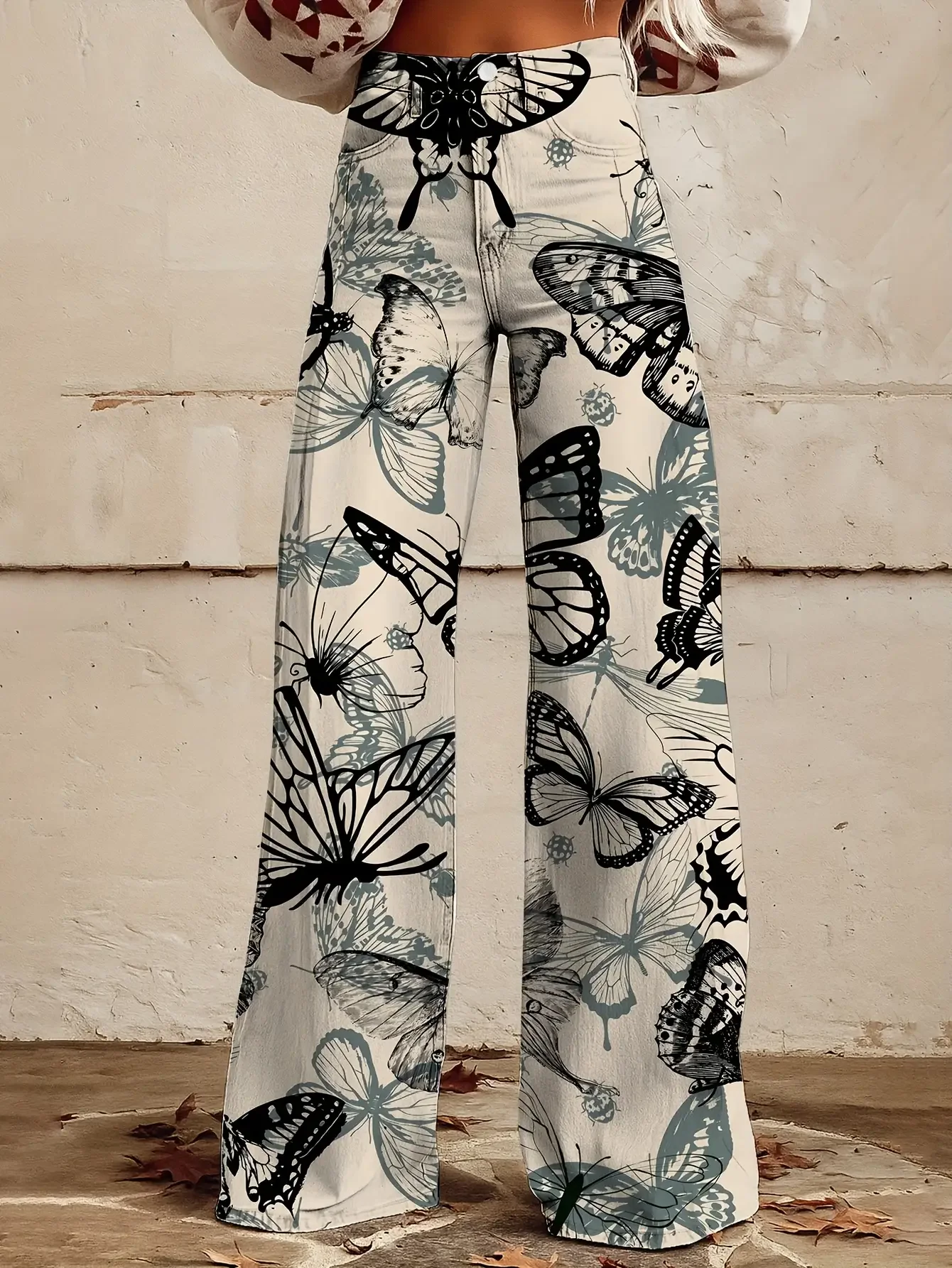  Casual jeans with a variety of colorful western prints, loose wide leg design, and fun printed women's pants