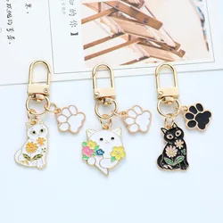 Cute Paw Flower Black And White Cat keychain for Women Girls Fashion Drop Oil Animal Key Chain Bag Pendant Jewelry Gift