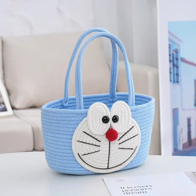 Cartoon Doraemon borsa a tracolla Dingdang Cat Cotton Rope Woven Handbag borsa per pannolini da viaggio borsa per la conservazione dei cartoni animati