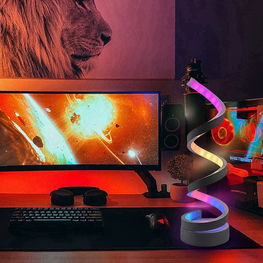 Modern spiral colorful desktop lamp with three-color dimming via USB, suitable for various types of rooms.