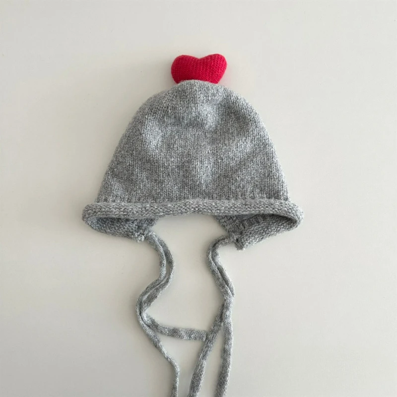 Topi Rajut Korea Gaya Musim Gugur dan Musim Dingin dengan Warna Solid, Tali, Pelindung Telinga, dan Topi Wol Hangat Bergaya untuk Anak-anak.