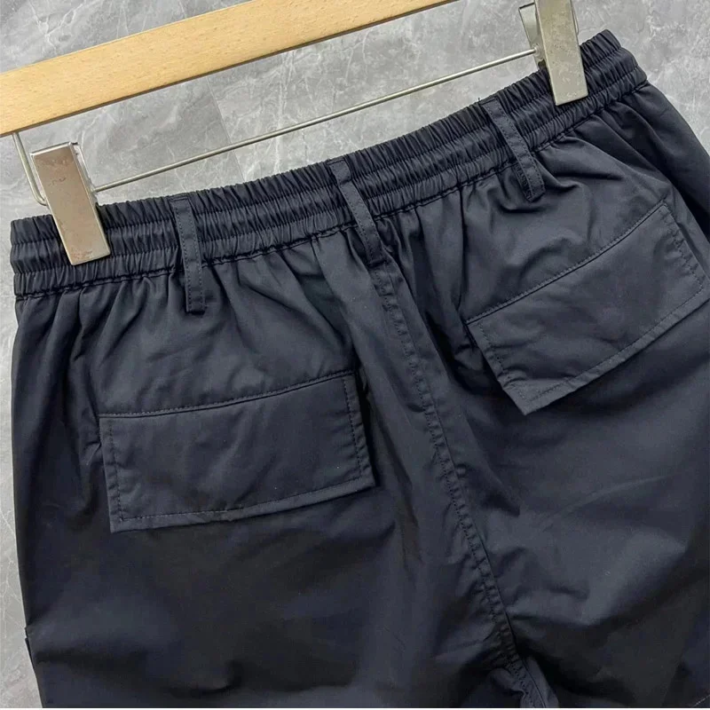 Pantalones cortos negros coreanos para hombre, ropa de calle de verano con múltiples bolsillos, estilo Safari, deportivos, informales, versátiles