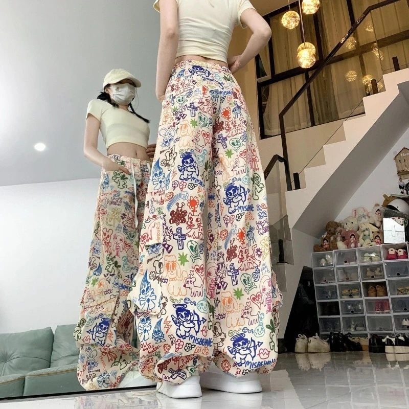 Men's Vintage Cartoon Graffiti Parachute Pants Summer Loose Fit Cargo Trousers With Multi Pockets Drawstring Cinched Ankles