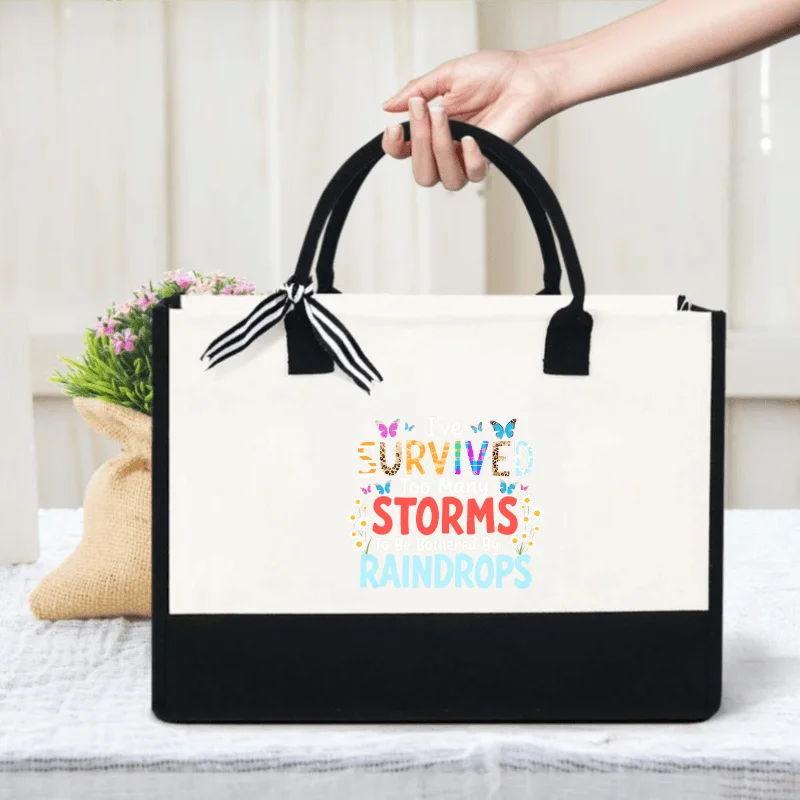 Cream and black canvas tote bags with weathered butterfly patterns and text are perfect for everyday use and shopping.