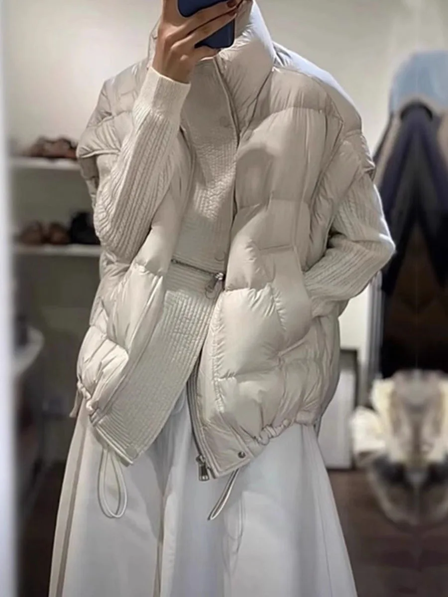 Casual stand up collar down vest for women wearing outside, 2026 autumn and winter, thick and warm, meat covering white duck dow