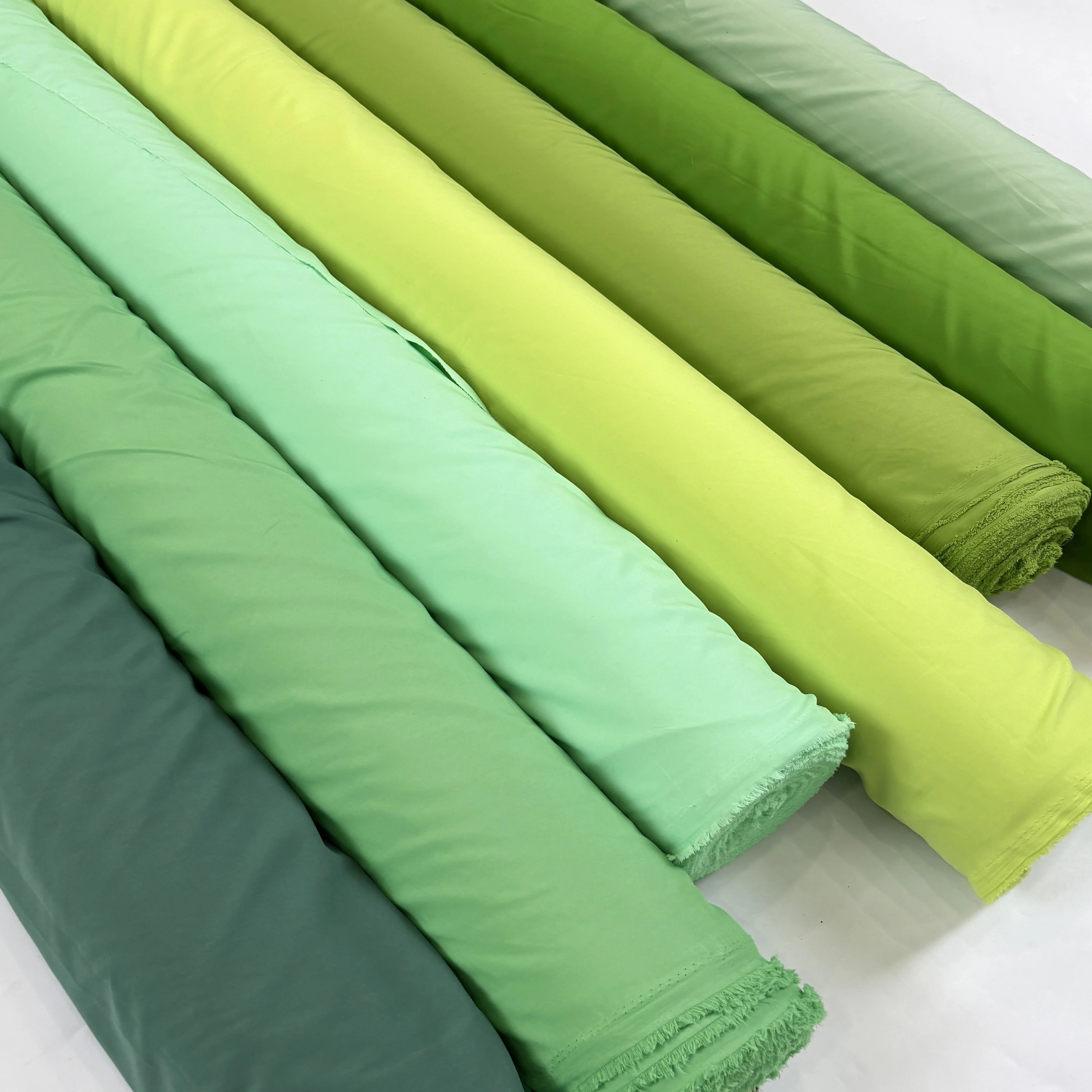 نسيج بطانة مرنة بأربعة جوانب ناعم بالمتر للملابس وسترة وتنورة وستارة مصنوعة يدويًا من القماش العادي باللون الأخضر والأزرق
