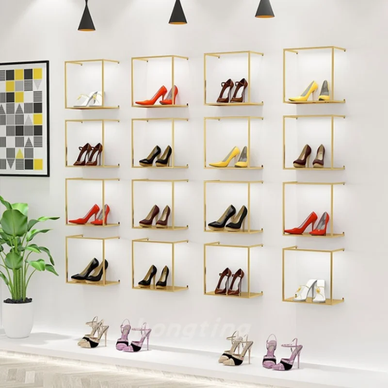 Custom, fashion retail shoe handbag shop fit out design fittings gold metal wall-mounted shoes bag display rack