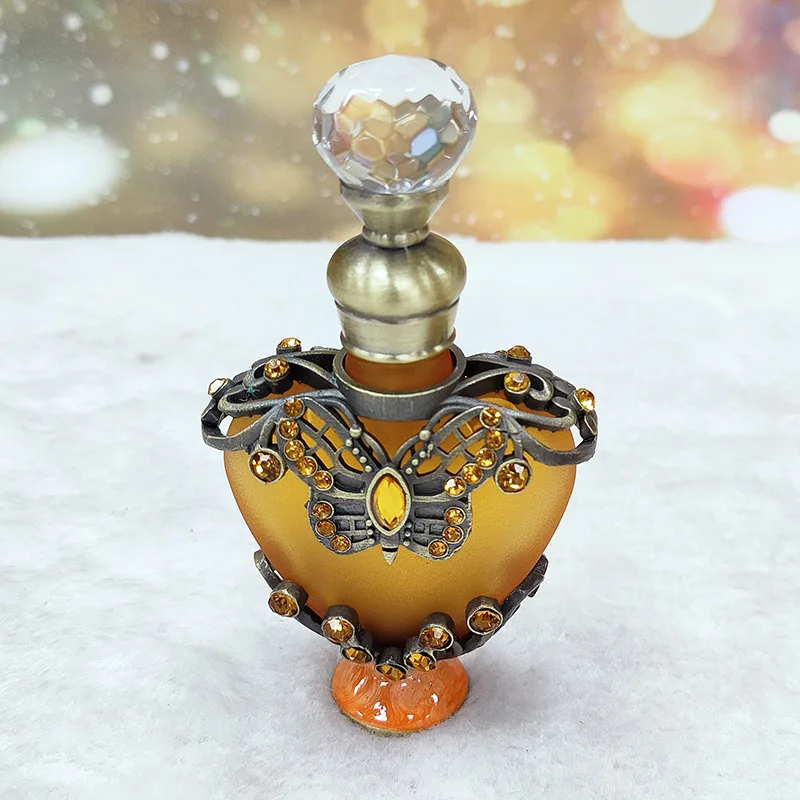 

Dubai metal jewellery model perfume bottle dispensing empty bottles essential oil bottle glass bottle 12ML heart-shaped perfume