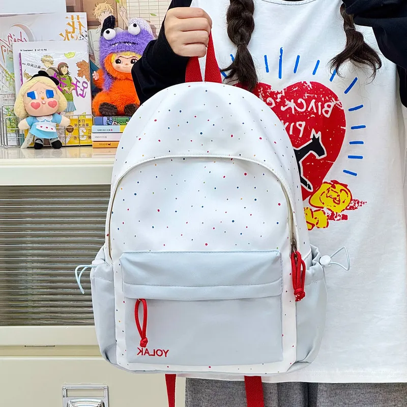 New Korean-style striped polka dot backpack for women, versatile for daily use, suitable for commuting, school bag for middle an