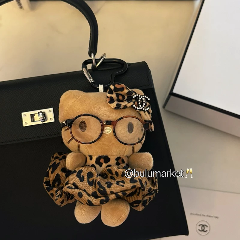 سانريو مرحبا كيتي الجلد الداكن أفخم المفاتيح Kawaii بلوشي محشوة اللعب دمية قلادة لحقيبة الظهر محفظة الفتيات حقيبة الملحقات