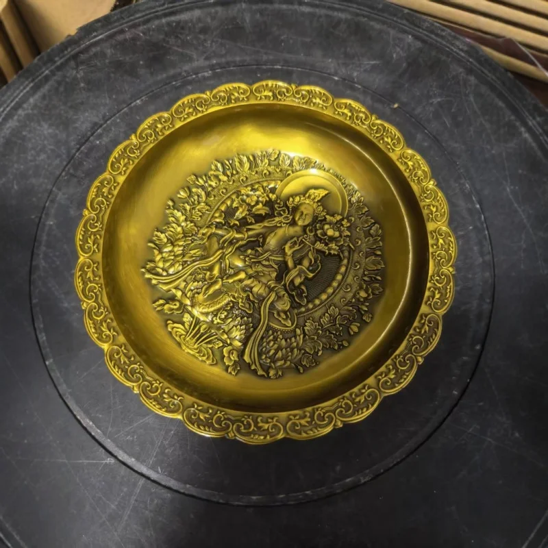 Embossed bronze Guanyin plate made in the Qianlong era, a decorative antique item, featuring a dragon and phoenix motif