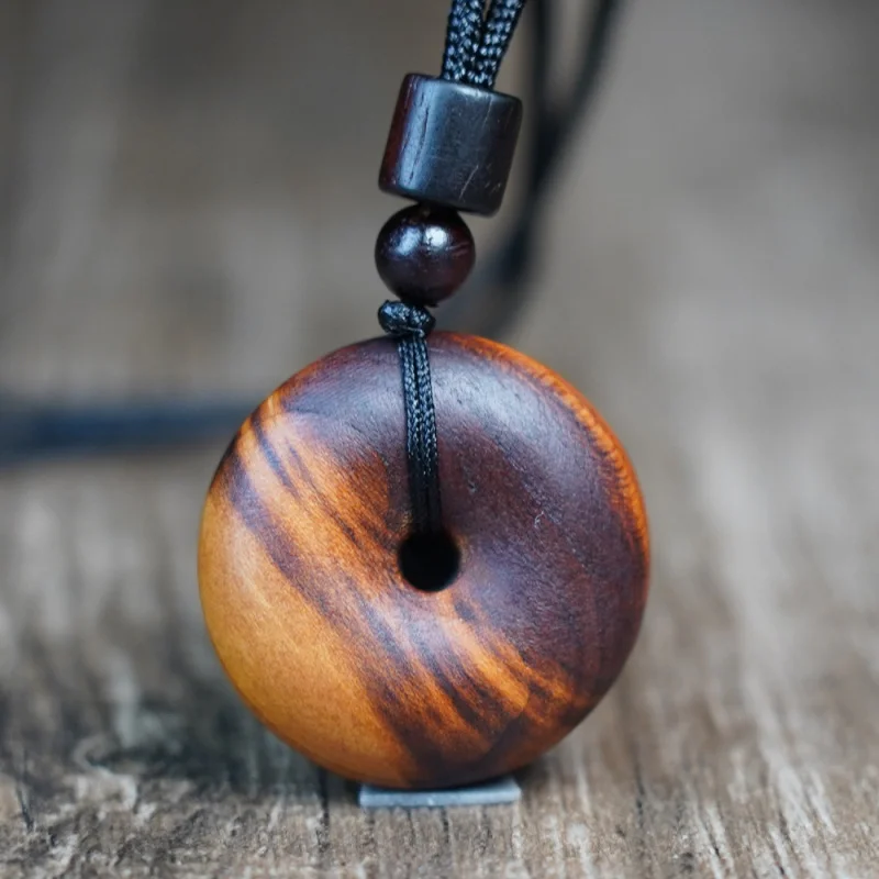 

Natural lightning-striken peach wood peace pendant, -carved wooden ornament with hand-engraved inscriptions