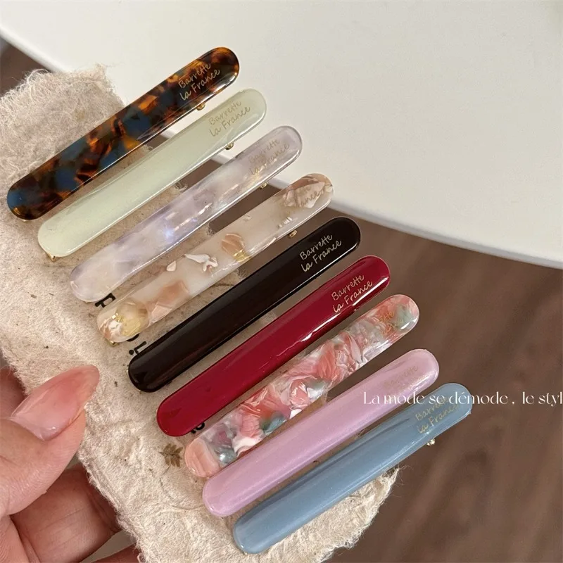 Korean version of the gold label cute little baguette one-word clip French acetic acid texture solid color side bangs clip