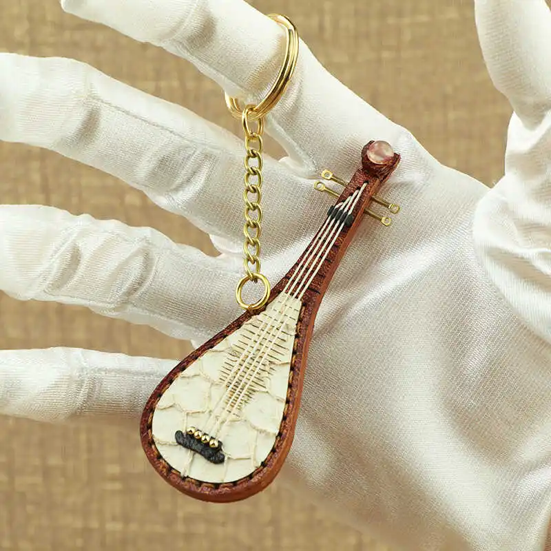 

Pipa retro folk music traditional instrument genuine leather pocket pipa cowhide keychain bag pendant handmade retro decoration