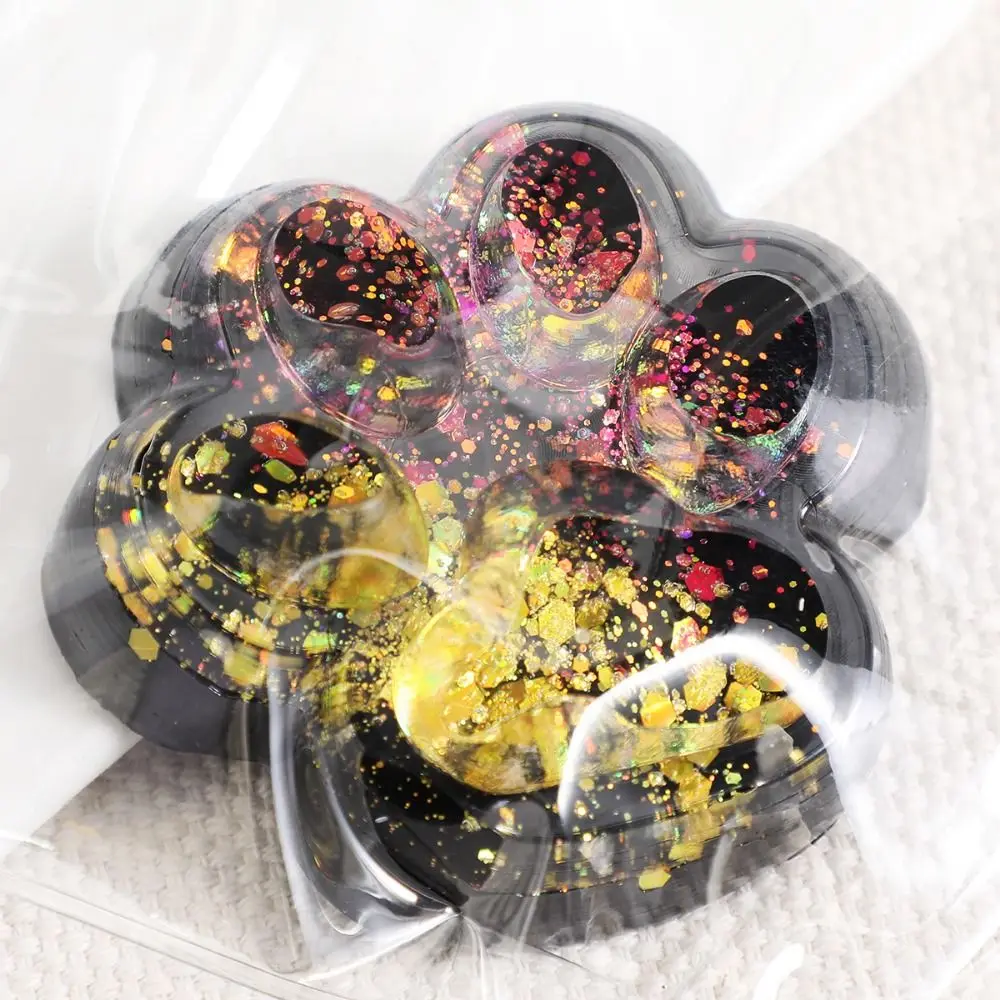 Blingbling Zampa di gatto a rimbalzo lento Giocattolo da spremere Lucido Impastare Zampa di gatto Giocattolo agitarsi Cubo trasparente colorato Zampa di gatto Pizzico giocattolo