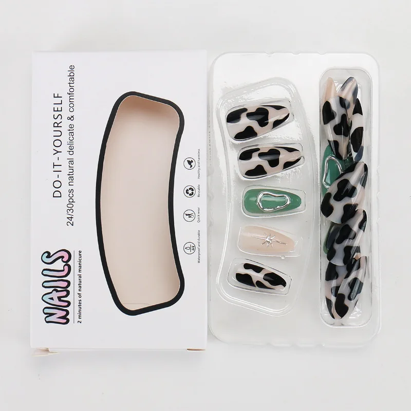 

Nail art piece wearing three-dimensional metallic star lines contrasting colors cow pattern personalized fake nails