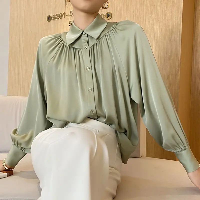 

Elegant Lapel Button Folds Lantern Sleeve Shirts Women Clothing 2024 Autumn New Loose Solid Color Chic Tops Office Lady Blouses