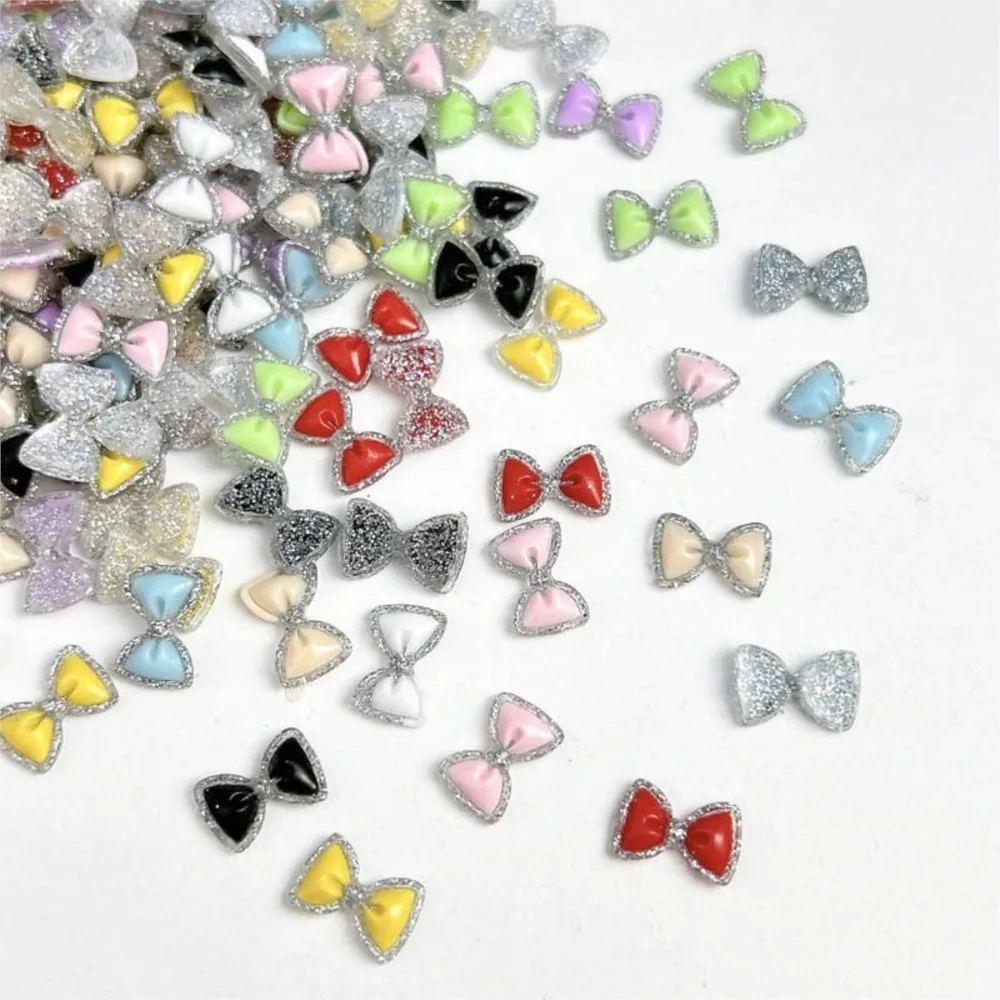 50 個発光カラフルなグリッターちょう結びネイルラインストーンスパークリングボウ樹脂ネイルチャーム 12*7 ミリメートルフラットバックボウタイネイル用品 E3