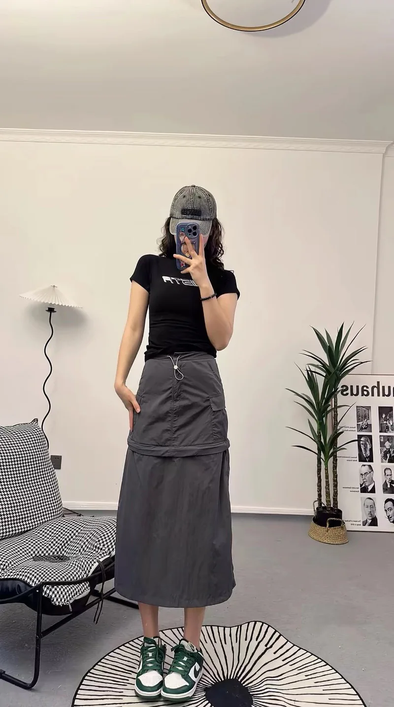 Letnia modna spódnica damska z niewidocznym zamkiem błyskawicznym, łączona, o średnim stanie, długa, prosta, w kształcie litery A, w jednolitym kolorze.