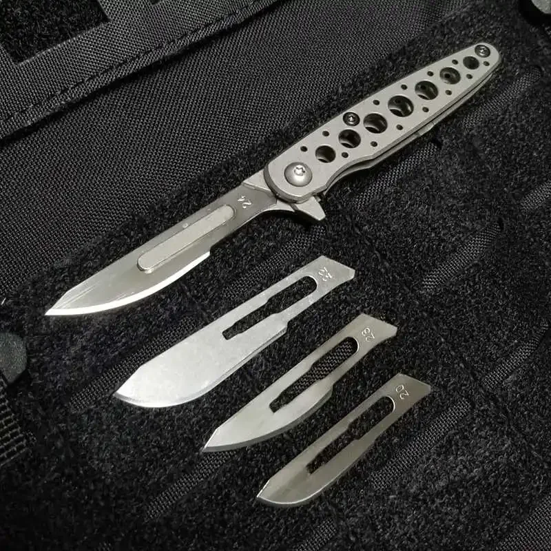 

1 Piece 7-hole hollowed-out fin-shaped Art Knife With 6 pcs Blade EDC titanium alloy back clamp titanium handle