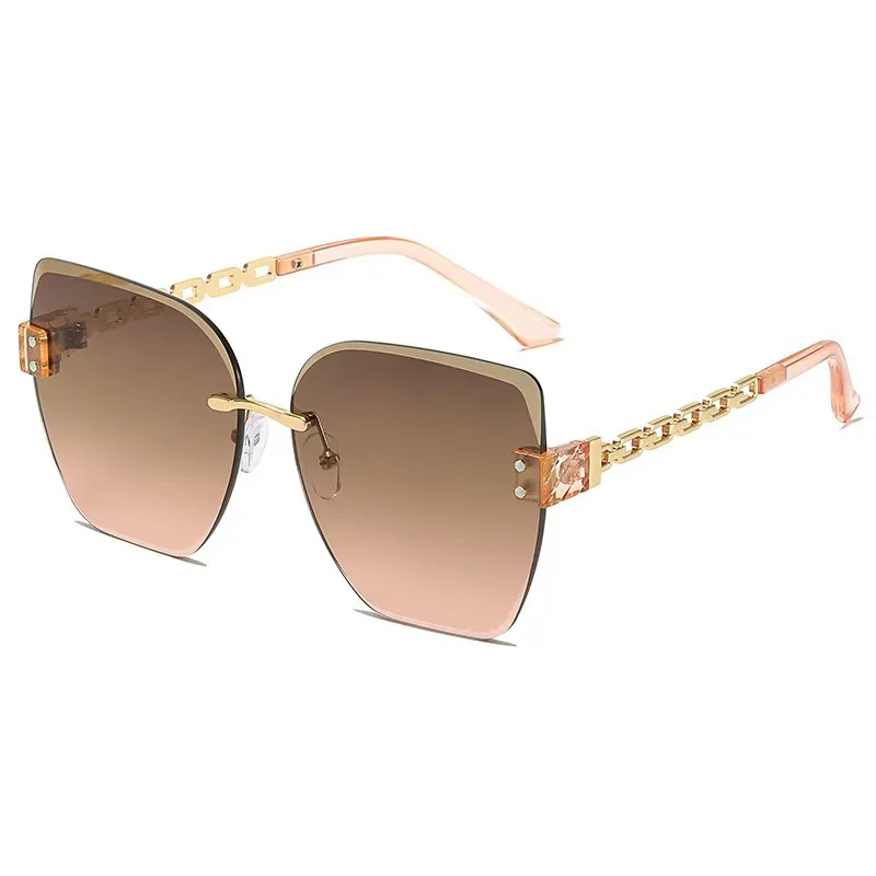 Gafas de sol retro europeas y americanas sin montura con cadena metálica, protección UV, estilo moderno para mujer.