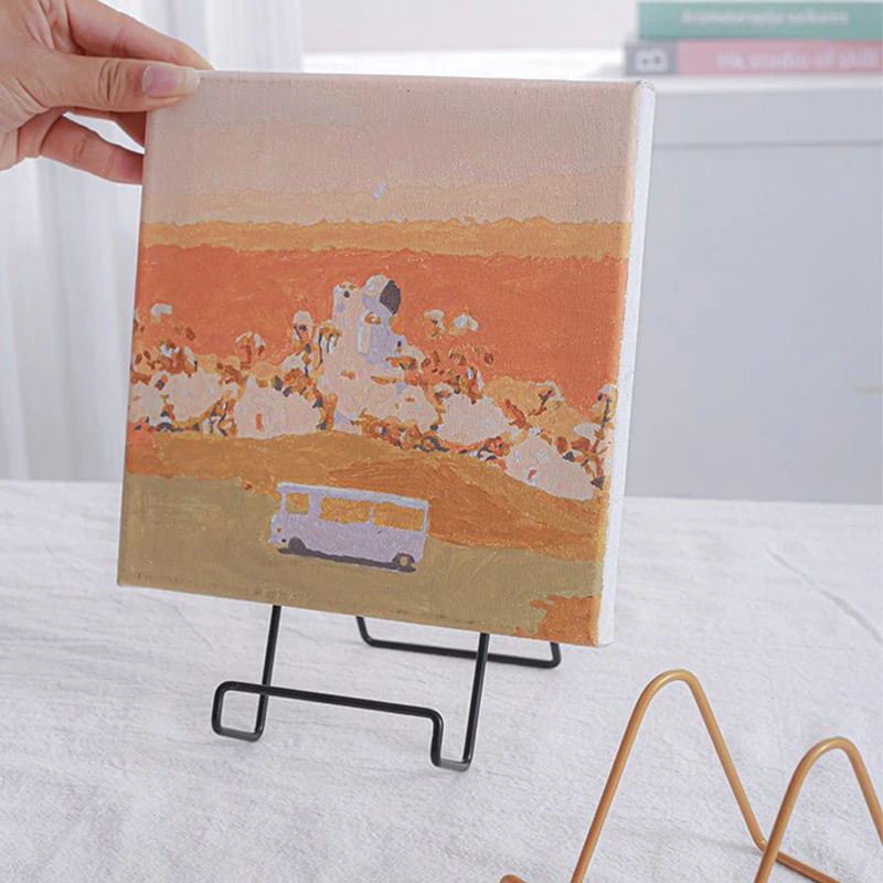 خمر نمط خمر حامل السجل ، بسيط الإبداعية المعادن عرض موقف ، CD تخزين الرف ، الحديد المطاوع إطار الصورة ، قوس ، 1 قطعة