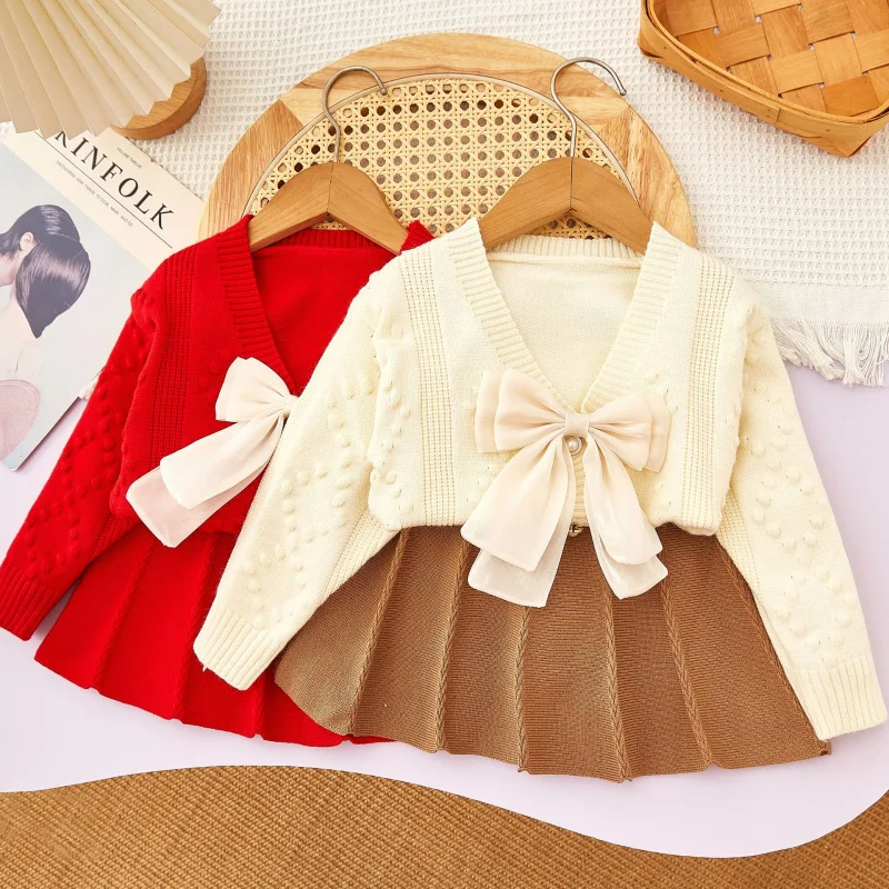 

Girls' Sweater Set Autumn Winter Simple Bowknot Preppy Style Knitted Long Sleeve Cardigan+Two-piece Short Skirt Set Wholesale