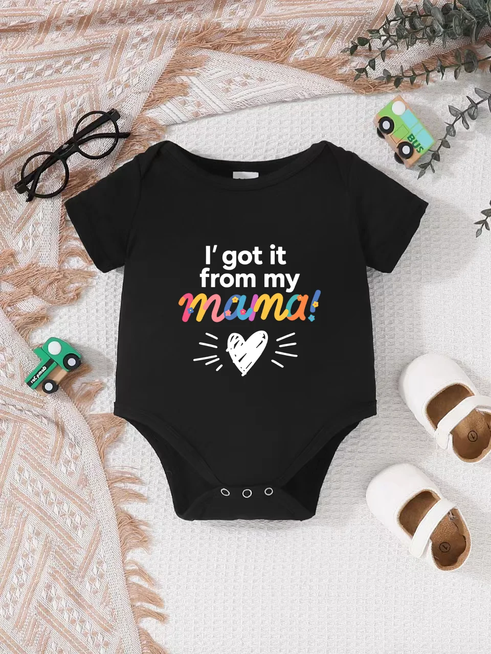 

Playful letter-printed baby short-sleeve triangle bodysuit. Button closure for easy dressing
