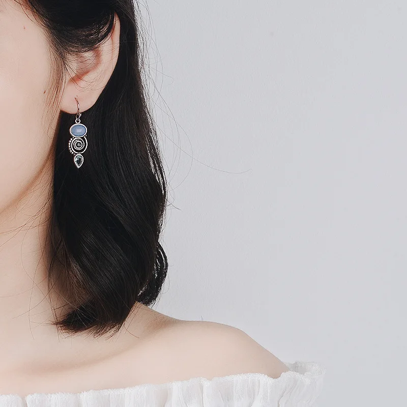 Trendy S925 Sterling Silver Stud Earrings With Inlaid Sea Blue Stones Creative Rotating Water Drop Pear Shaped Design For Women