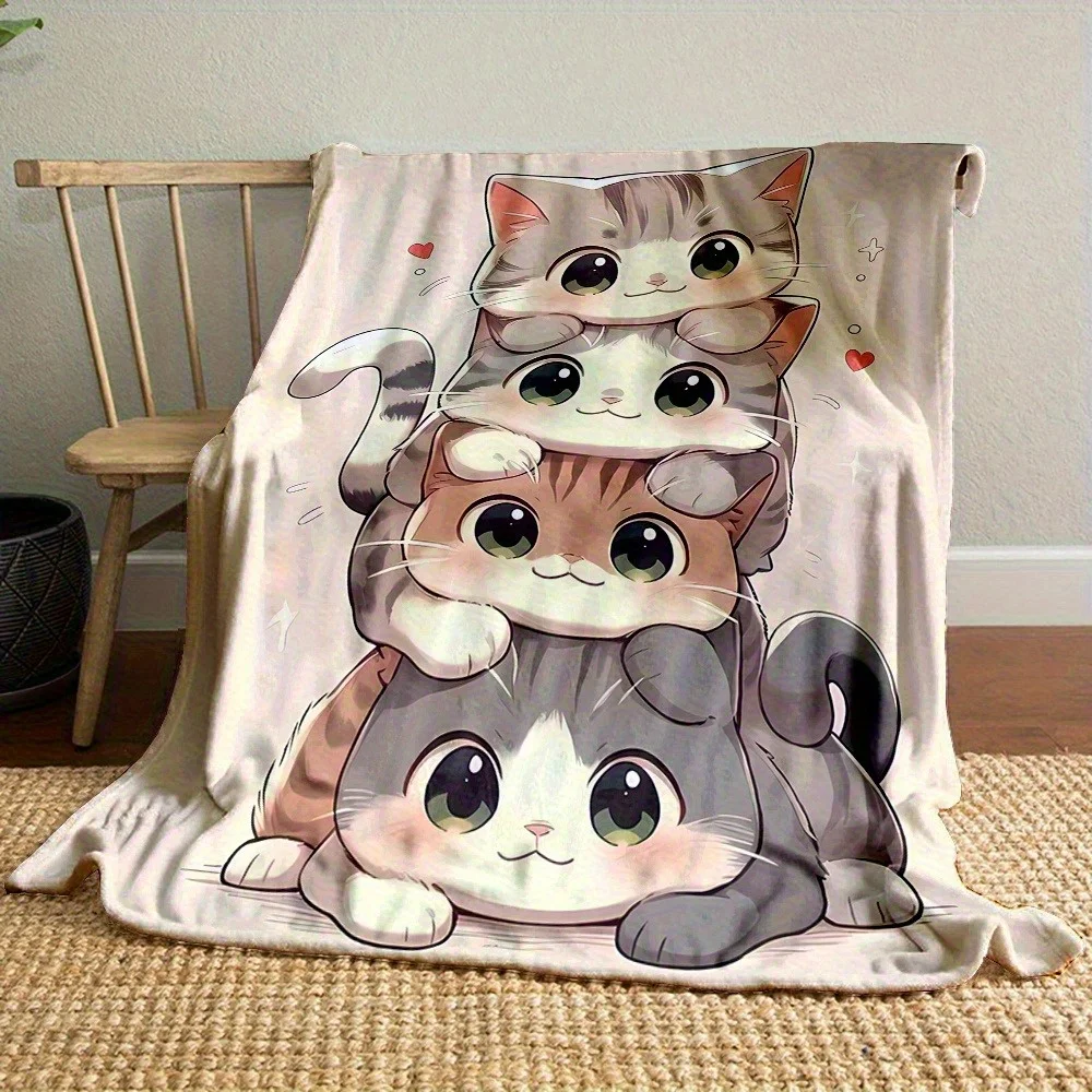 A Small Blanket/throw Featuring a Manga-style Pattern of Four Cats Playing Together, Stacked on Top of Each Other. Suitable for
