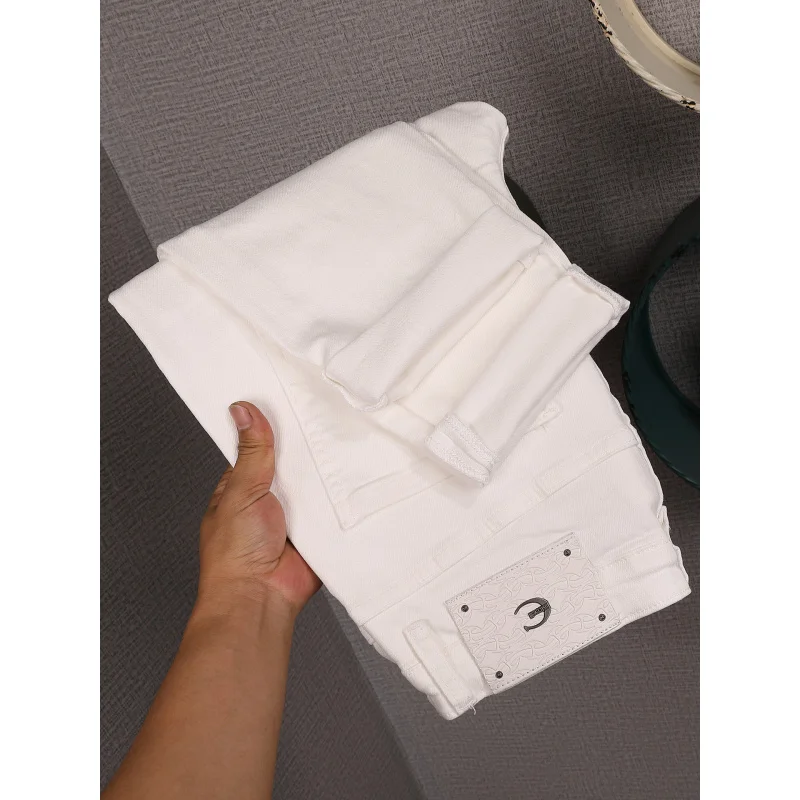 2026 new high American style white jeans for men's street fashion, fake hole patch, slim fit small leg pants