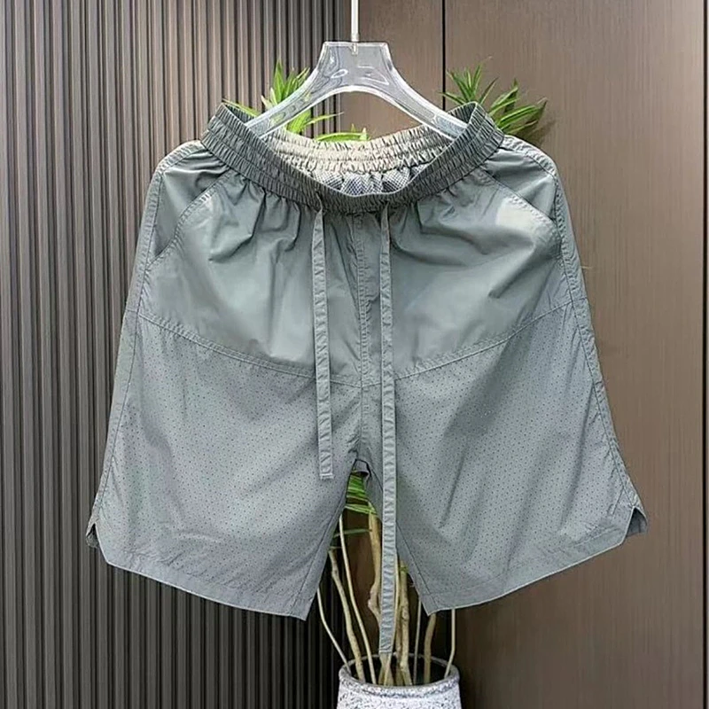 Pantaloni casual da uomo in seta di ghiaccio traspirante vestibilità ampia Qui Dry quattro-cinque lunghezza estate nuovi pantaloni a gamba dritta Sle Faionable