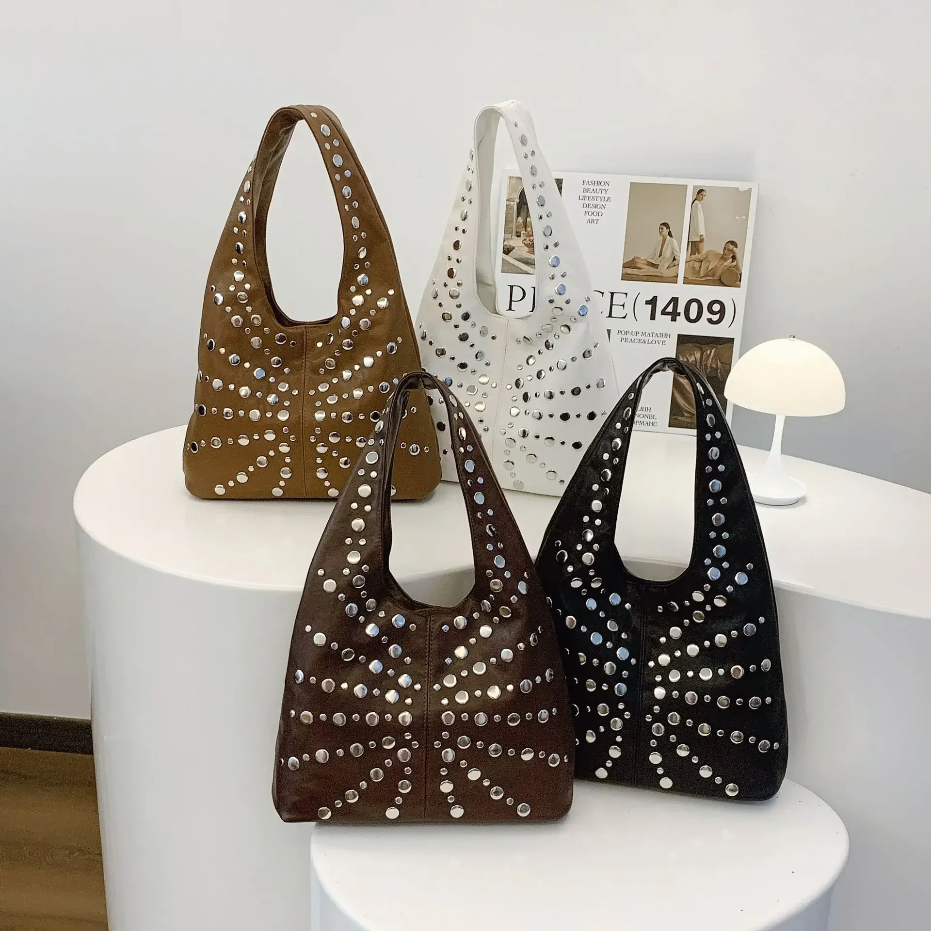 

2025 Niche Women's Goth Rivet Bucket Bag - Euro-American Style Large Capacity Commuter Locomotive Trend