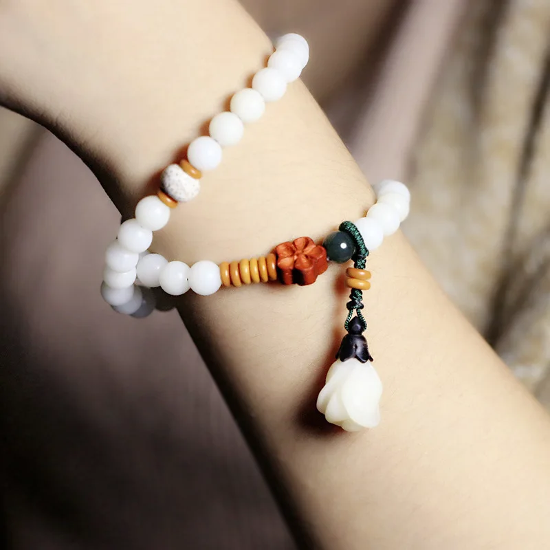 

Literary style small fresh Bracelet Bodhi hand string white jade Bodhi root carved Lily pendant female jewelry gift