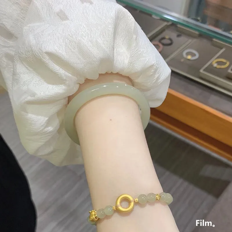 Hetian jade, a fine, round, and slender bracelet made of Qingbai jade, featuring a clear and bright color, a delicate design, an