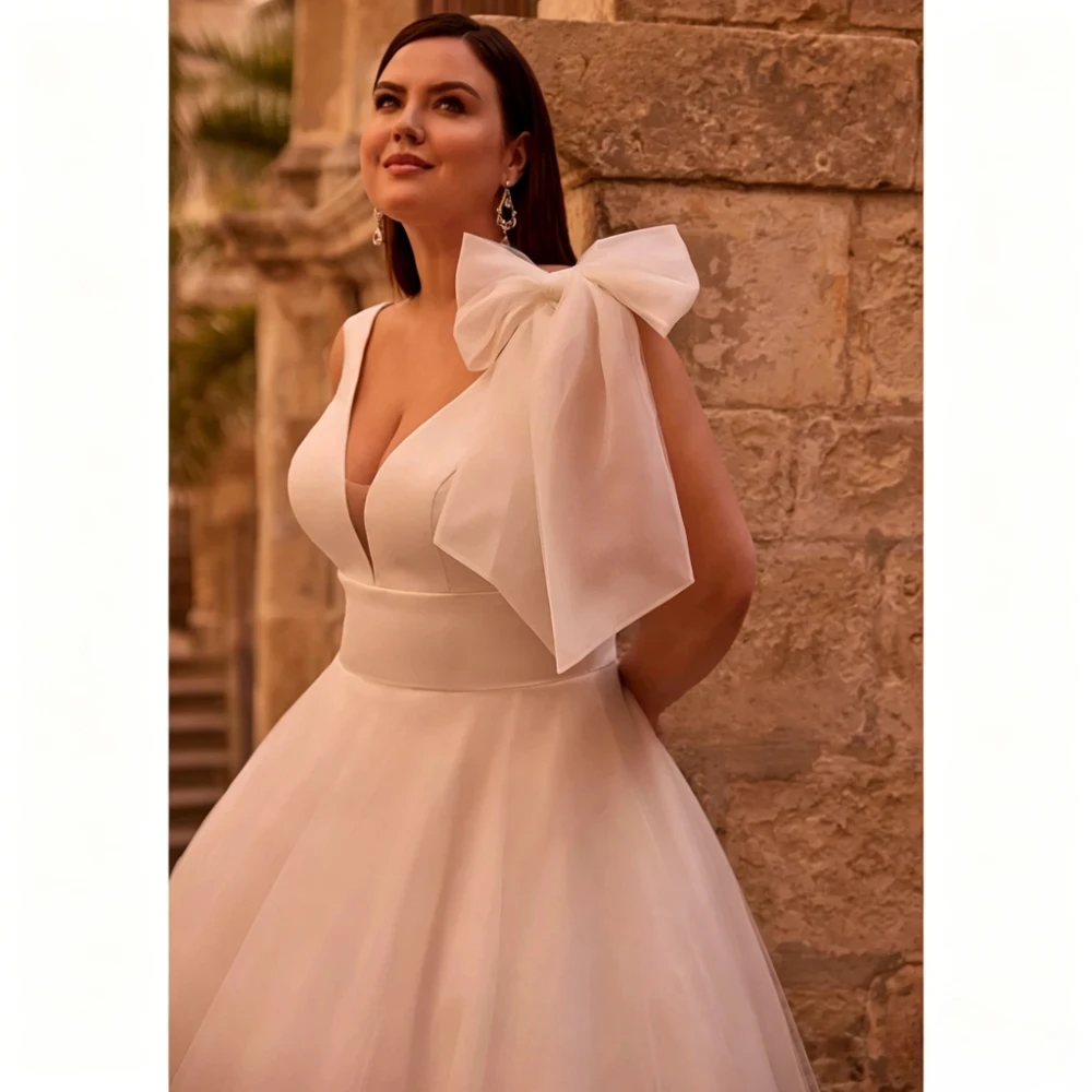 Customized Minimalist A Line Wedding Dress Deep V Sleeveless Single Shoulder Big Bow Soft Tulle Floor Length Bridal Gown