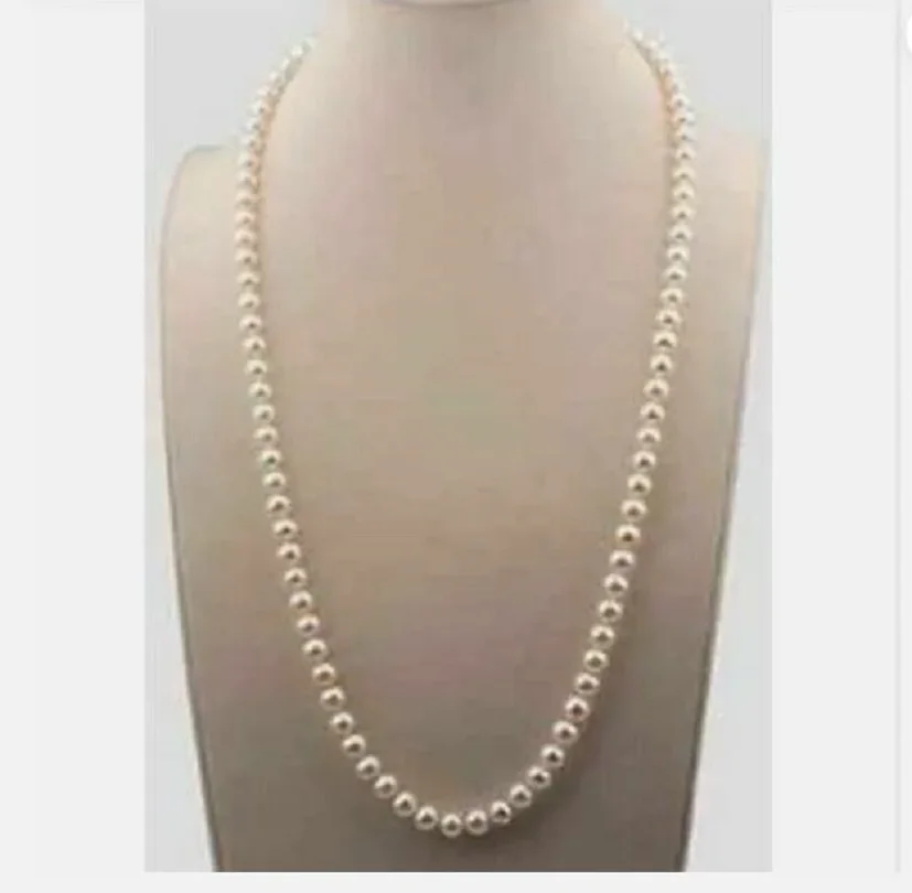 

22-inch beautiful AAA 7-8mm white South China Sea pearl necklace 14K yellow gold buckle.